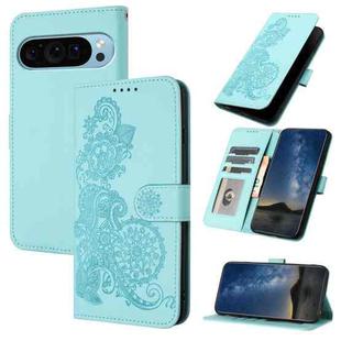 For Google Pixel 9 Datura Flower Embossed Flip Leather Phone Case(Light blue)