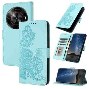 For ZTE Blade A75 5G / Nubia Focus Datura Flower Embossed Flip Leather Phone Case(Light Blue)