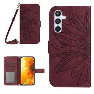 For Samsung Galaxy A17 5G Skin Feel Sun Flower Embossed Flip Leather Phone Case with Lanyard(Wine Red)