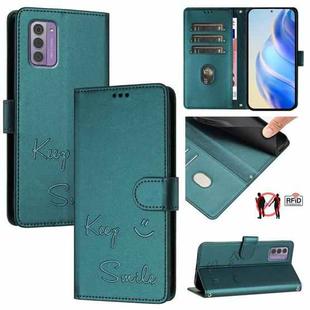 For Nokia G42 / G310 Smile Embossing RFID Leather Phone Case(Peacock Green)