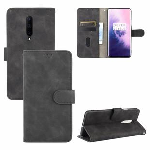 For OnePlus 7 Pro Solid Color Skin Feel Magnetic Buckle Horizontal Flip Calf Texture PU Leather Case with Holder & Card Slots & Wallet(Black)