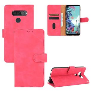 For LG Q70 Solid Color Skin Feel Magnetic Buckle Horizontal Flip Calf Texture PU Leather Case with Holder & Card Slots & Wallet(Rose Red)