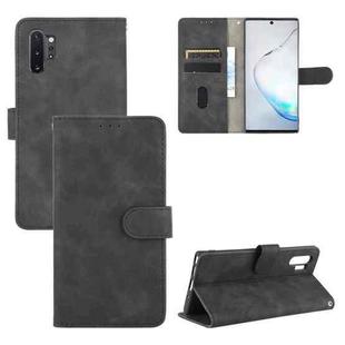 For Samsung Galaxy Note10 Plus Solid Color Skin Feel Magnetic Buckle Horizontal Flip Calf Texture PU Leather Case with Holder & Card Slots & Wallet(Black)