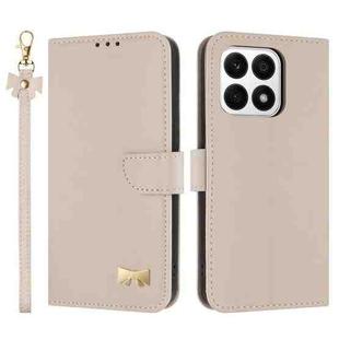 For Honor X8a 5G Global Metal Bow Leather Phone Case with Hand Strap(Apricot)