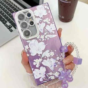 For Samsung Galaxy S23 Ultra 5G Electroplating Flowers Plants Texture Wristband TPU Phone Case(Pale Purple FlowerFL11)